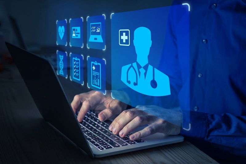 Icon image; person at a laptop, icons on the theme of medicine